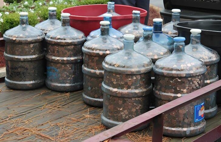 Man saves coins for 45 years, rolls 15 water jugs into bank and tells teller to deposit ’em all….