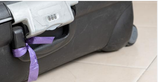 Baggage handler reveals why you should never tie a ribbon on your luggage